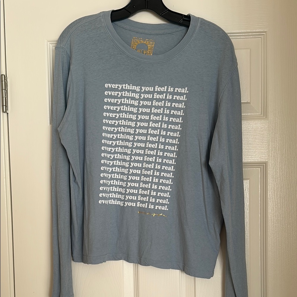 Spiritual Gangster Blue Long Sleeve Graphic Tee “Everything You Feel Is Real”